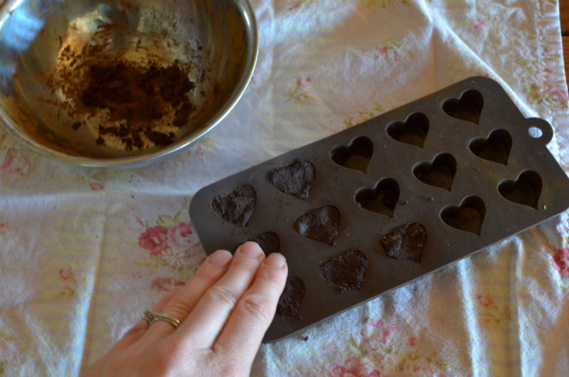 pack silicone candy mold with herb/honey mixture