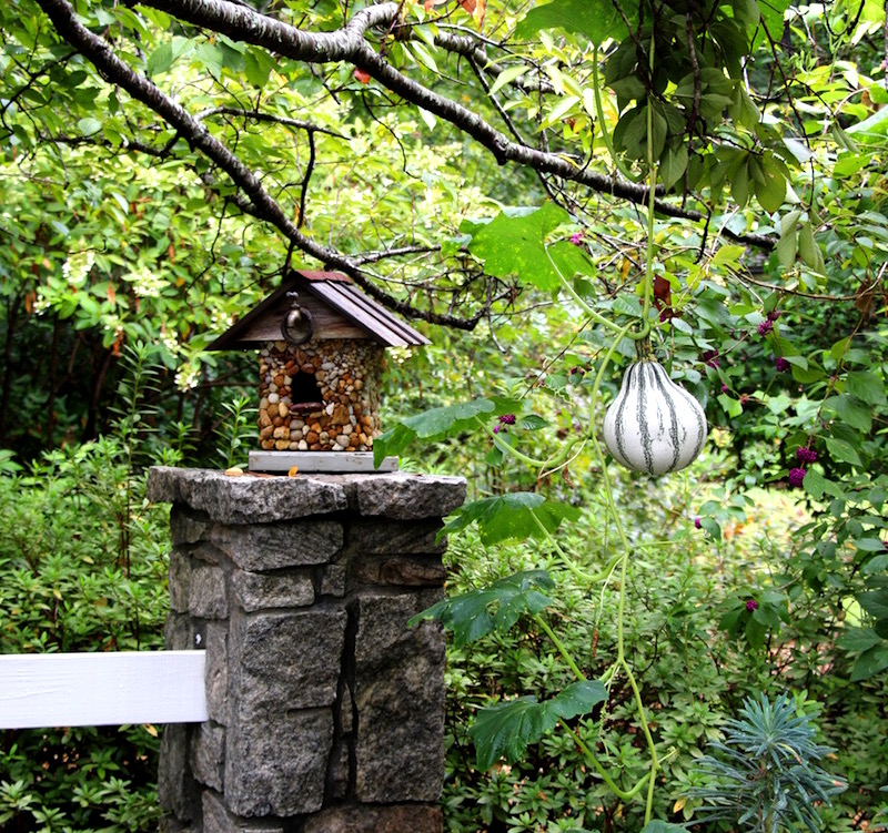 stone-covered birdhouse